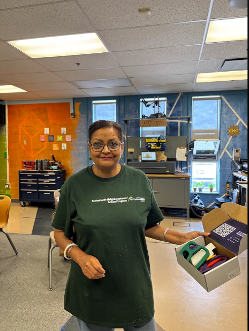 A volunteer at the workshop with an open MNDX package